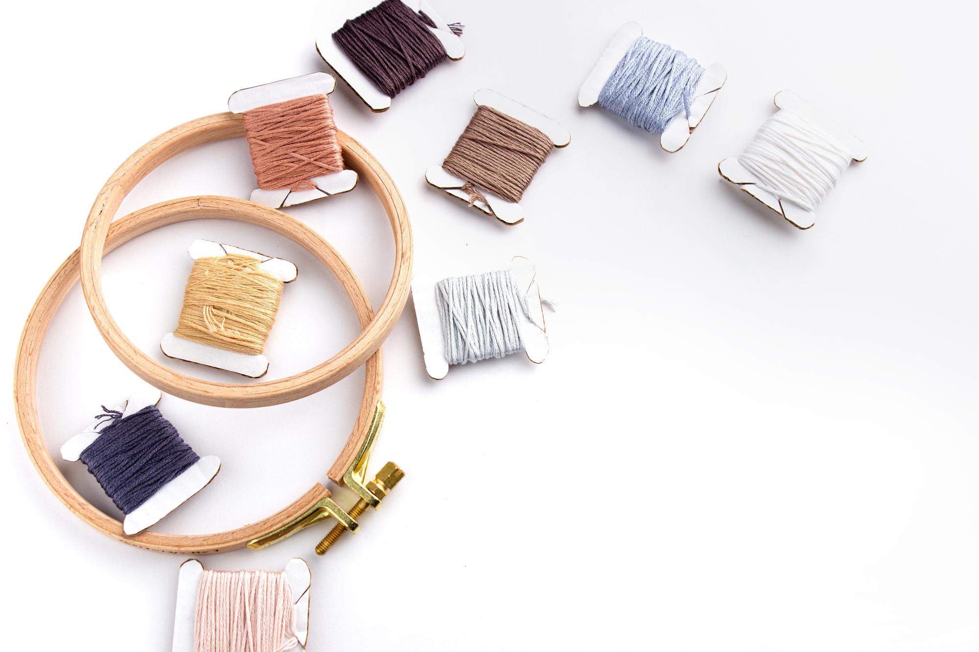 selection of embroidery threads and hoops